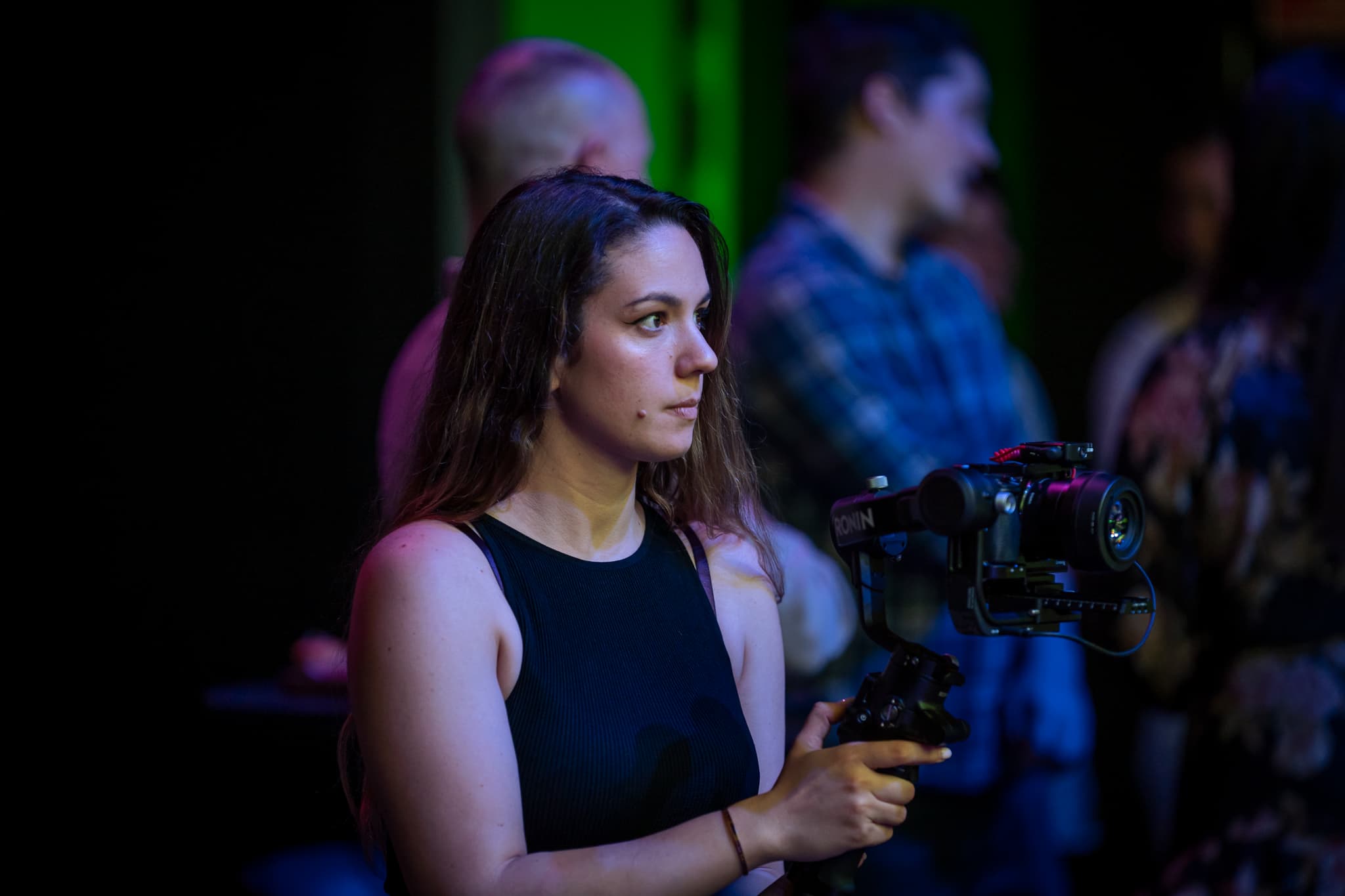 Alexandra filming with a camera stabilizer at an event